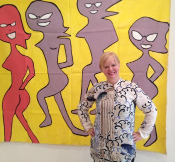 Cindy Wilson of the B-52s in front of her painting featured in Paper Covers Rock. lg.JPG