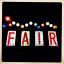 The iconic Elberton 12 County Fair sign lights the entrance.